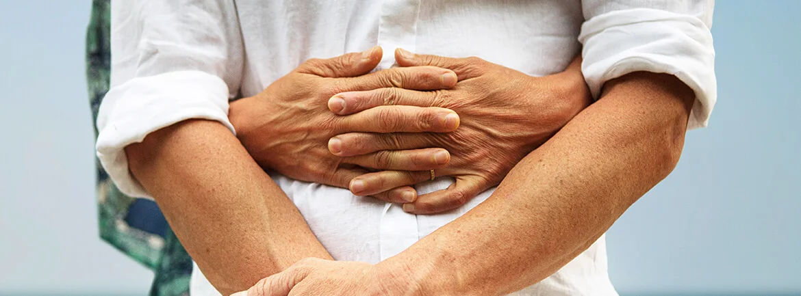 a close-up of folded hands