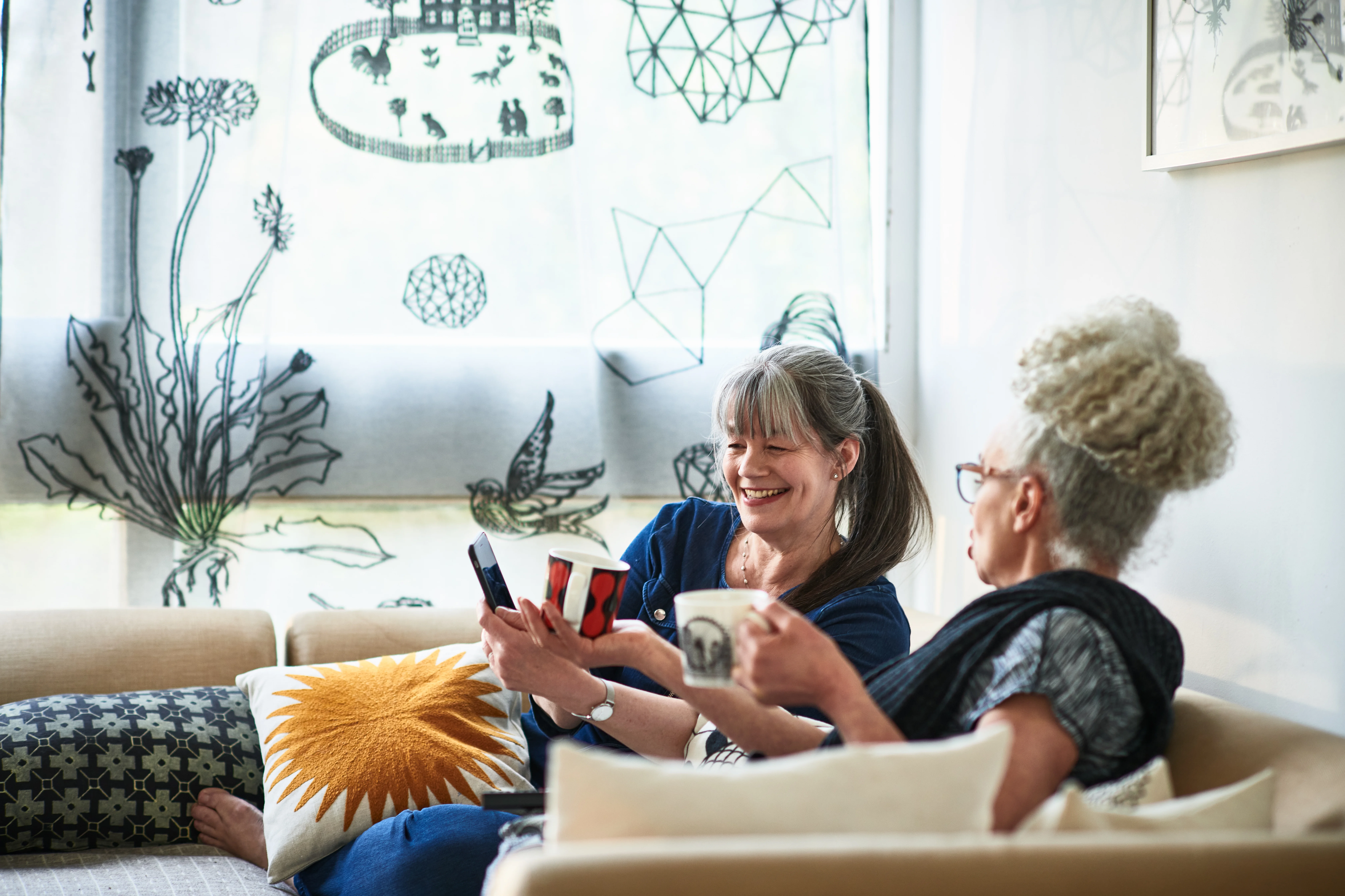 a group of women sitting on a couch