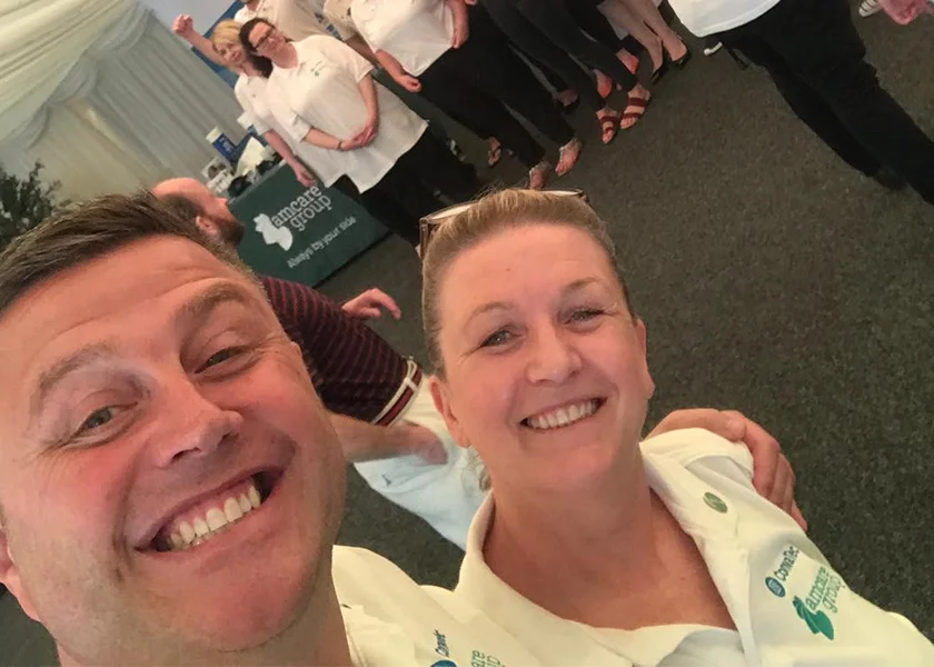 man living with a stoma posing with partner 