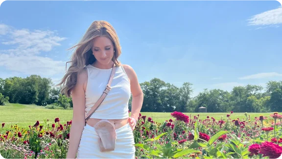 woman wearing stoma pouch in a field 